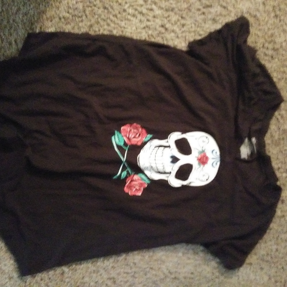 Black shirt with a skull design and roses